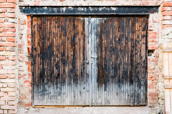 The old garage door in brick wall
