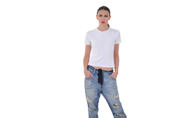 Young girl posing in blue jean pant and white thsirt at studio — Stockfoto