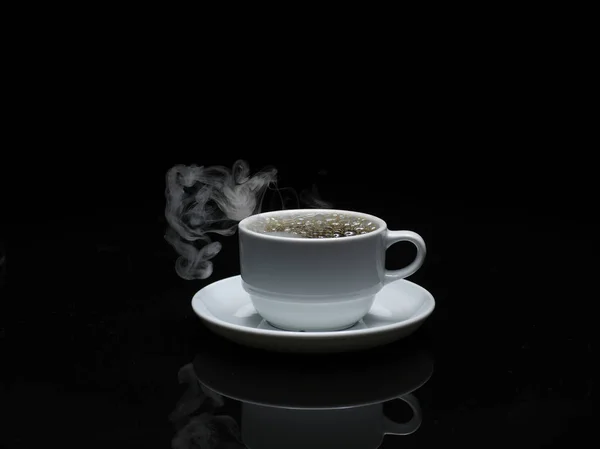 Warm cup of coffee with smoke on black background — Stock Photo, Image