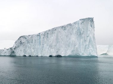 huge icebergs on arctic ocean Greenlandglacier clipart