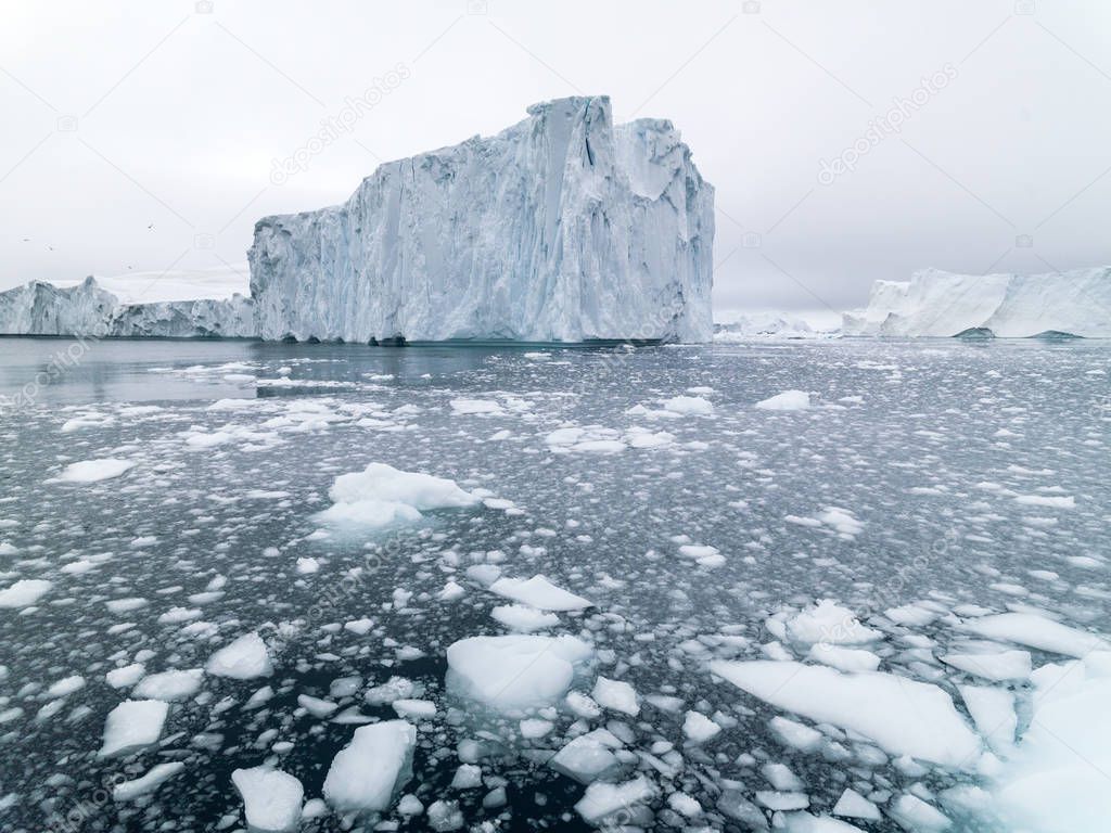 Arctic icebergs from boat.