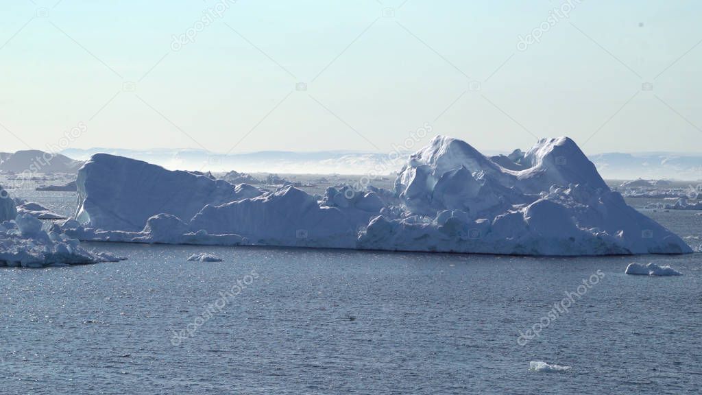 Arctic icebergs on arctic ocean in Greenland