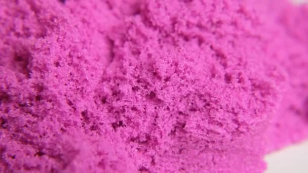 En närbild av rosa kinetisk sand. Makroskott — Stockvideo