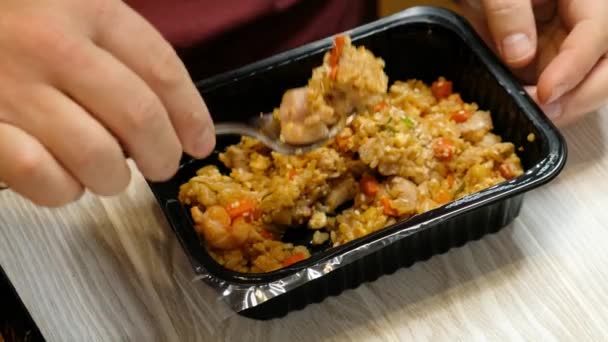 Man eating take away food on a table. Food delivery concept, close up — Stock Video