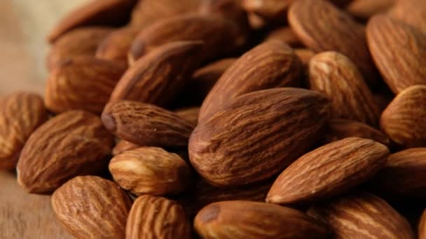 Raw Peeled almonds nuts closeup rotating, macro shot — Stok video