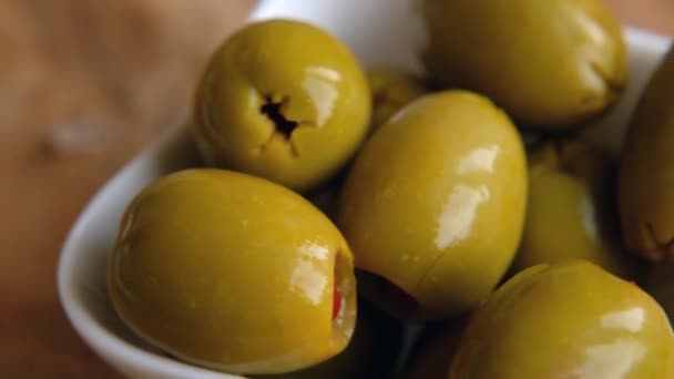 Green Olives Stuffed with Red Bell Peppers rotating, close up. Macro — Stok video