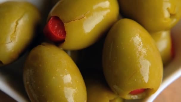 Green Olives Stuffed with Red Bell Peppers rotating, close up. Macro — 비디오
