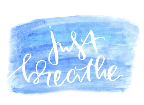 Just breathe - handwritten modern calligraphy text on watercolor spot. Just Breathe. Inspirational vector typography. Lettering at blue watercolor stroke. Typography with brush calligraphy