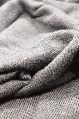 Bu desenli gri kumaş arkaplanının bir fotoğrafı.