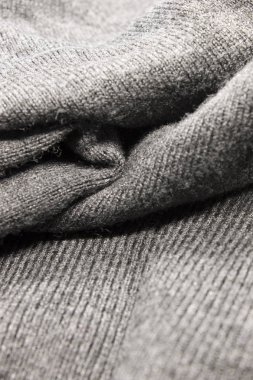 Bu desenli gri kumaş arkaplanının bir fotoğrafı.