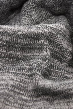 Bu desenli gri kumaş arkaplanının bir fotoğrafı.