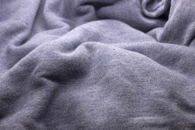 Bu, desenli açık renkli mor kumaş arkaplanının fotoğrafı.