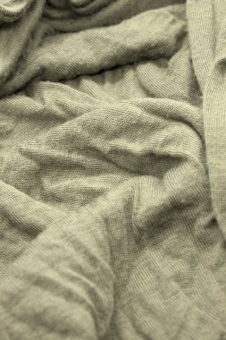 Bu, zeytin yeşili kumaşın dokulu bir fotoğrafı.