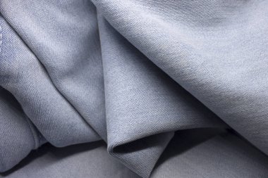 Bu açık mavi kot arka planının bir fotoğrafı.