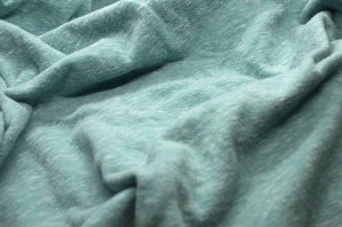 Bu, dokulu Turkuaz kumaşın bir fotoğrafı.