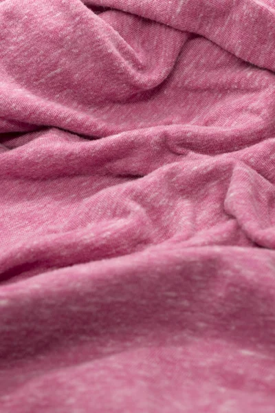 This is a photograph of textured light Pink fabric