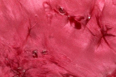 Bu kırmızı holografik bir arkaplanın fotoğrafı.