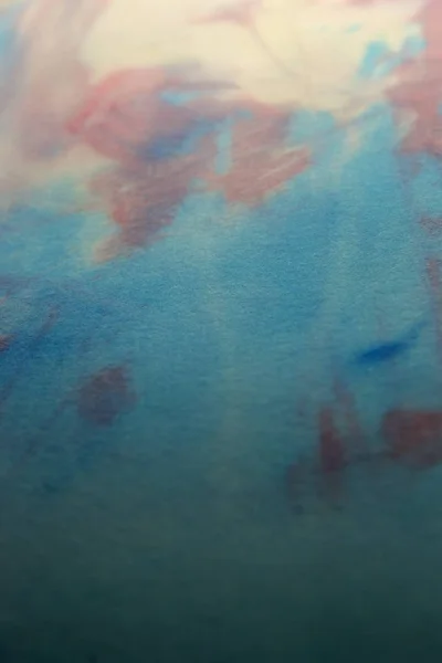 This is a photograph of a Blue, Pink and Yellow abstract background created using watercolours