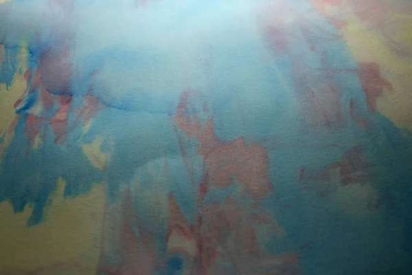 This is a photograph of a Blue, Pink and Yellow abstract background created using watercolours