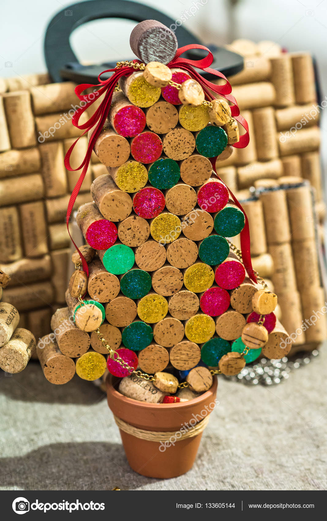 Corks from wine are set out as a Christmas tree in a pot — by okskukuruza