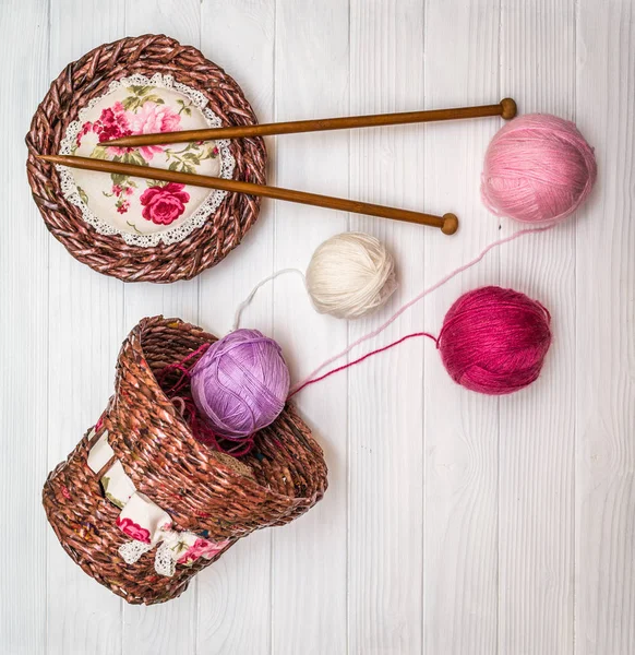 Balls of yarn on a wooden board — Stock Photo, Image
