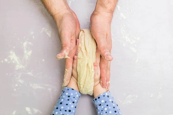 Children and dad hands make a dough — Stock Photo, Image