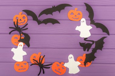 Cadılar Bayramı siluetleri yuvarlak çerçevesinde yapılan kağıt kesti