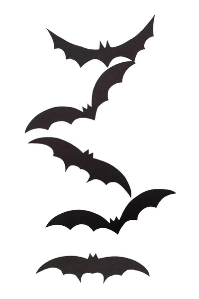 Silhouettes of volatile bats carved out of black paper are isolated on white — Stock Photo, Image