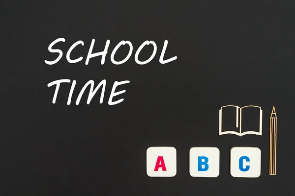 Abc letters and chipboard miniature on blackboard with text school time — Stock Photo, Image