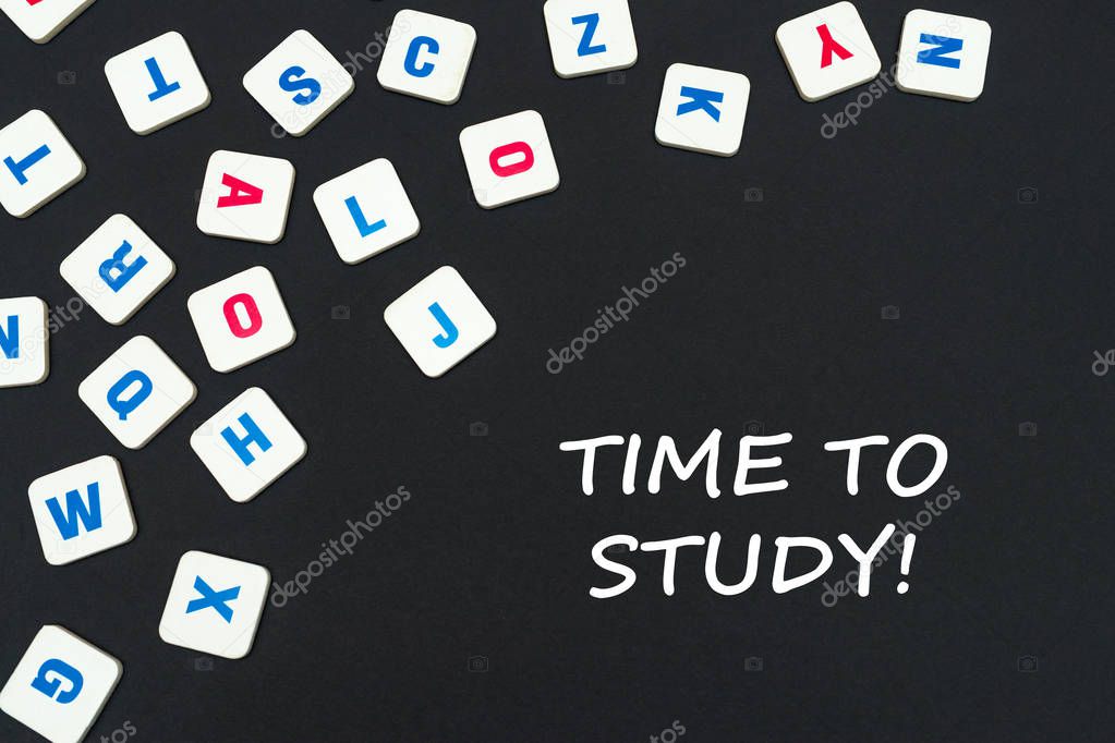 english colored square letters scattered on black background with text time to study