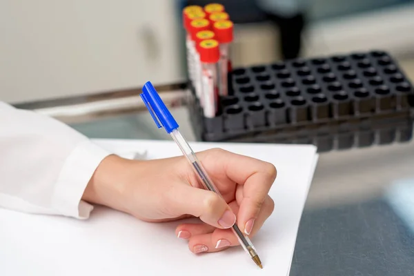 Nurse Writes Diagnosis Blood Sample Test Tubes Table — Stock Photo, Image