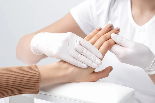 Manicurist Holding Fingers Woman Beige Manicure Salon — Stock Photo, Image