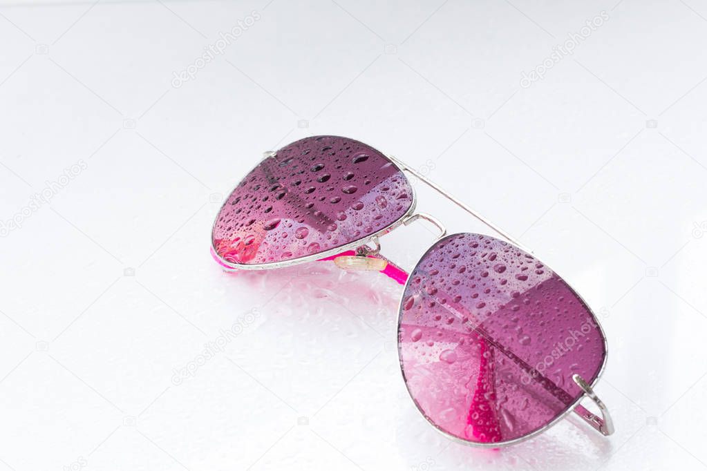 rose-colored glasses on white background