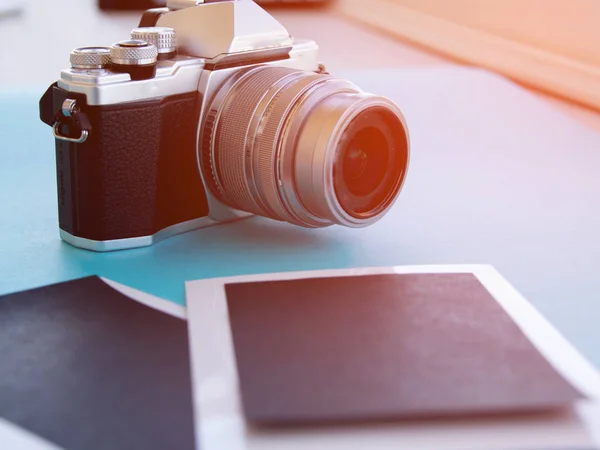 Close up photo of old camera lens over wooden table. image is retro filtered. selective focus — Stock Photo, Image