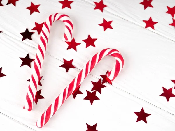 Christmas candy cane on white wood background, Christmas decors red gift boxes