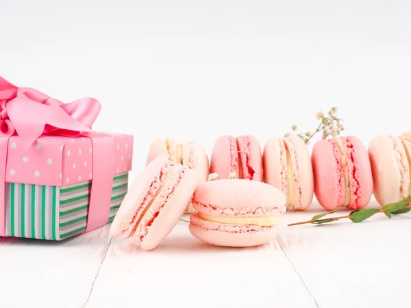 Colorful macaroons, Colorful french dessert, traditional french colorful macarons in a rows in a box