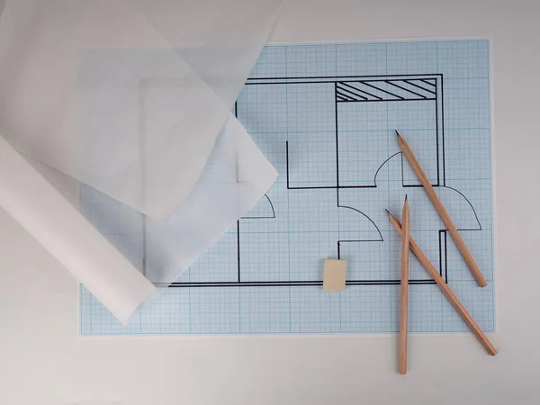 architectural drawings for the layout of the apartment design, millimeter paper, tracing paper in a roll and pencils