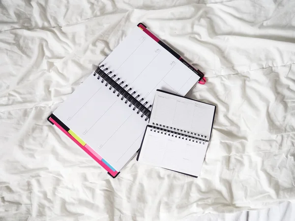 diary on a white cloth lies, the concept of remote work, freelance, work from home, comfort, blogger.