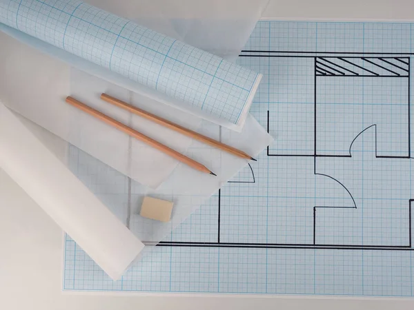 architectural drawings for the layout of the apartment design, millimeter paper, tracing paper in a roll and pencils.