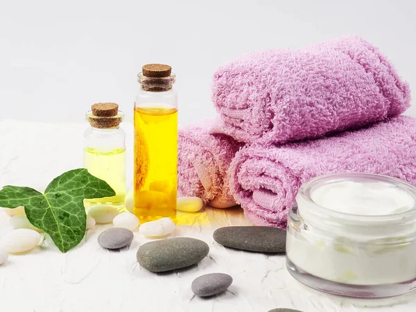 Spa accessories with stones, Composition of spa treatment on table colorful background.