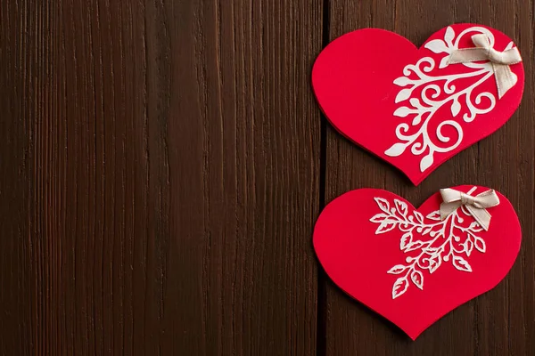 Valentine\'s day background with valentine card on wooden background