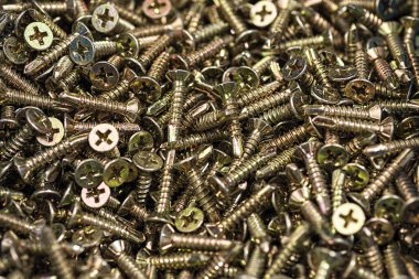 Altın vida makro yakın çekim. Arka plan deseni.