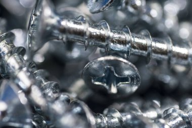 Gümüş vida makro yakın çekim. Arka plan deseni.