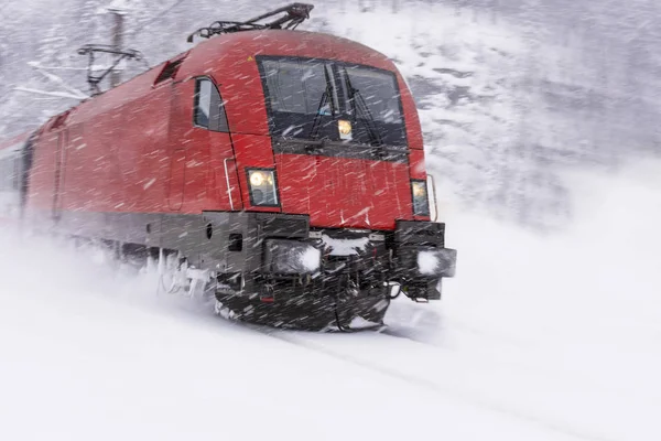 Fast Train in Heavy Snow Storm. Blizzard on Railway. — Stock Photo, Image