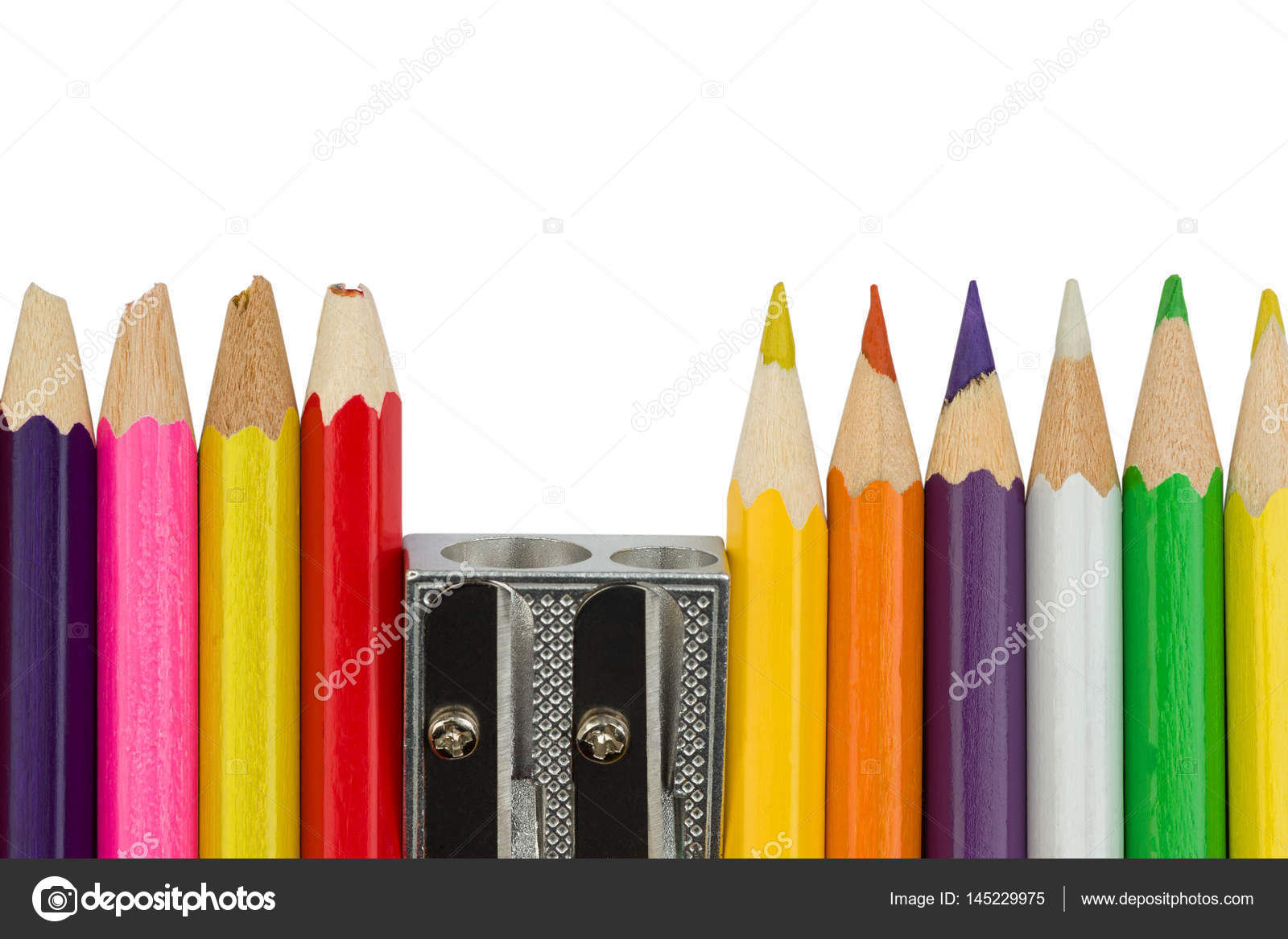 Colored pencils with a sharpener in the pack — Stock Photo © taknote