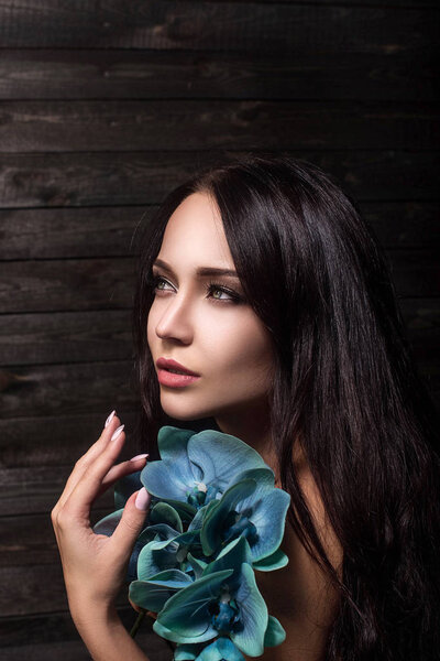 sensual girl with orchid flowers