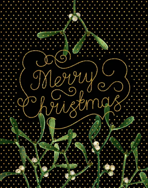 Greeting Christmas card with mistletoe isolated on black background. Watercolor postcard with mistletoe, hand drawn gold glitter letters, ready to print.