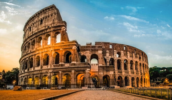 Colosseum at dusk in Rome, Italy. Rome architecture and landmark, cityscape. Rome postcard.