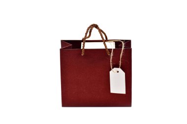 Gift bag with box and label isolated on white background