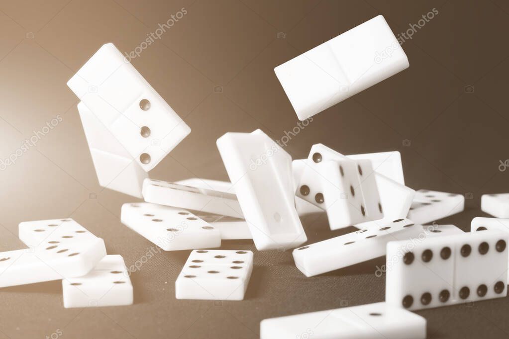 Fallen dominoes chips. Conceptual business or sport illustrative ides. Color shaded tint.